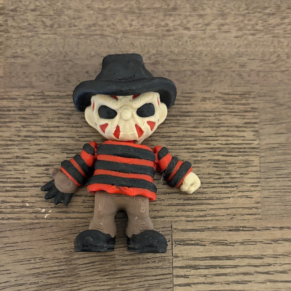 Striped Black and Red Action Figure